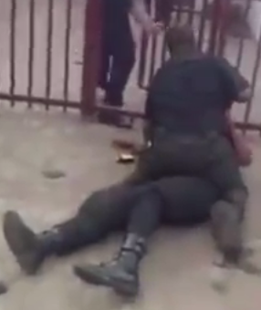 2 Photos/video: Two policemen fight each other in public