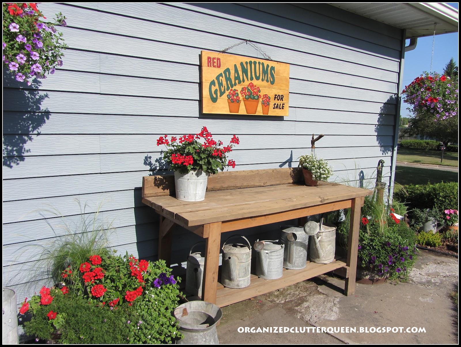 Potting Bench, Whiskey Barrels, and Hanging Pails Organized Clutter