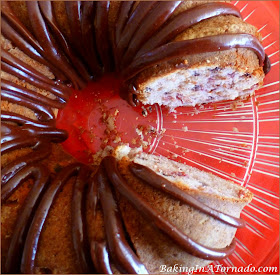 Chocolate Raspberry Martini Cake, mini chocolate chips, fresh raspberries and a hint of alcohol baked into a bundt cake. | Recipe developed by www.BakingInATornado.com | #recipe #cake #chocolate #raspberry