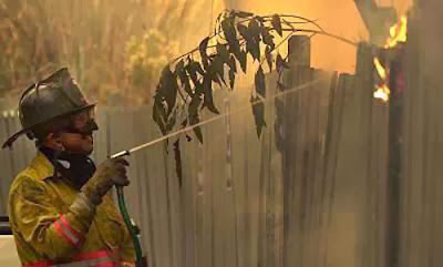 Funny fireman uses water pistol to stop the fire