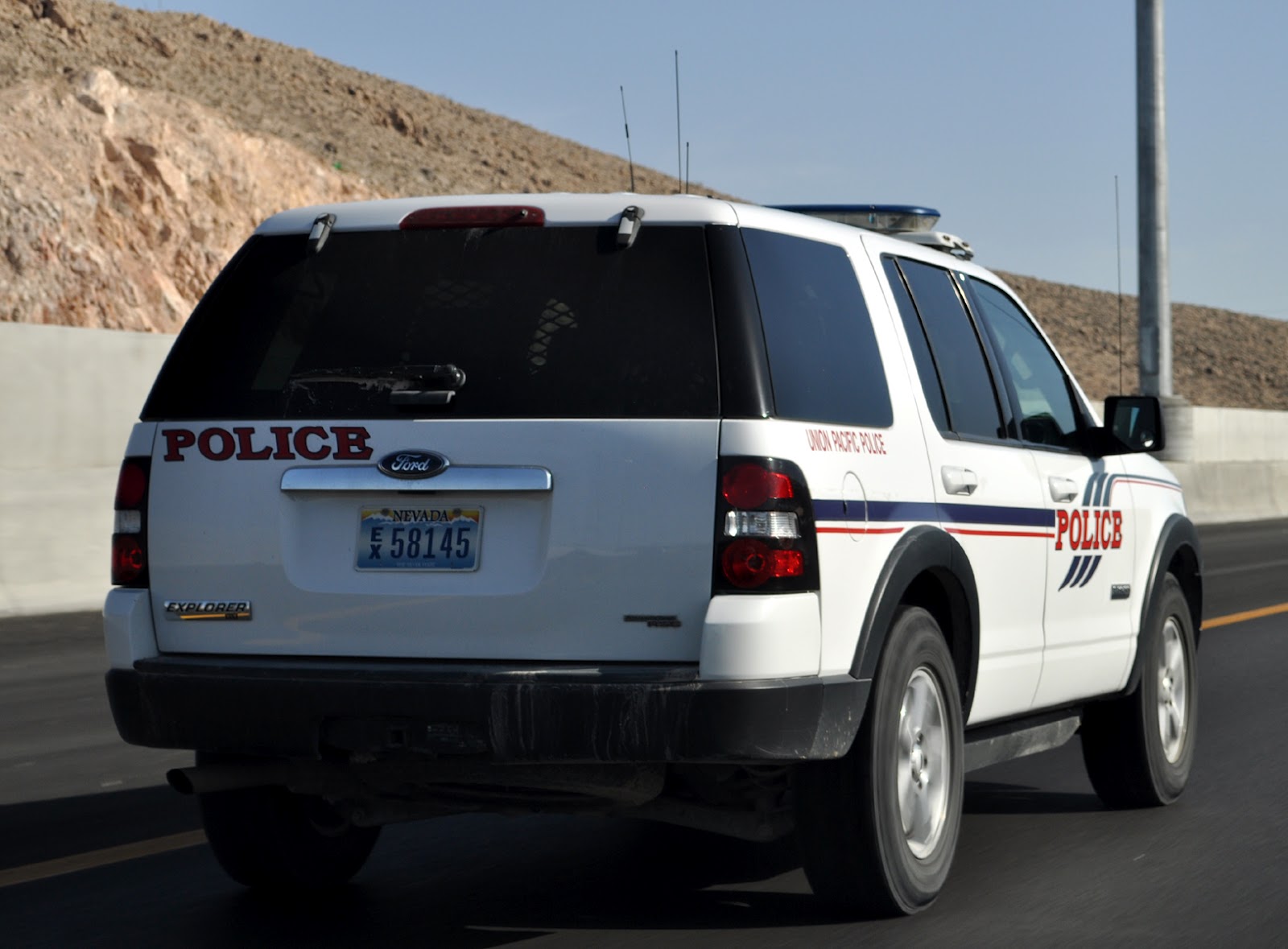 Just A Car Guy What the hell is a train cop doing driving a law