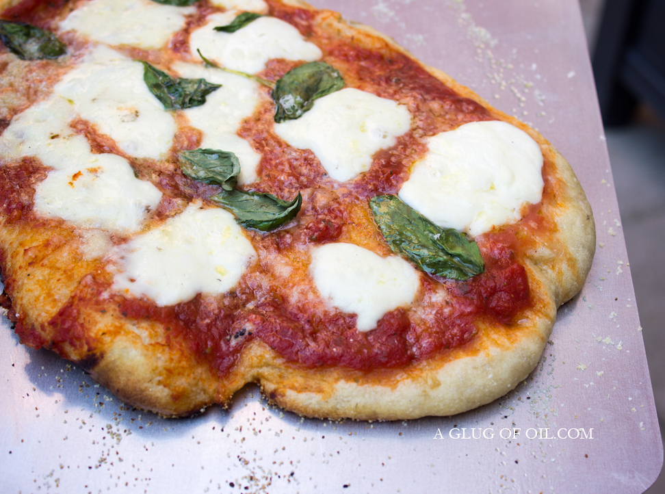 Margherita Pizza cooked in a Wood-fired Pizza Oven Margherita Pizza cooked in a Wood-fired Pizza Oven