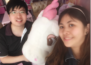 couple with unicorn toy