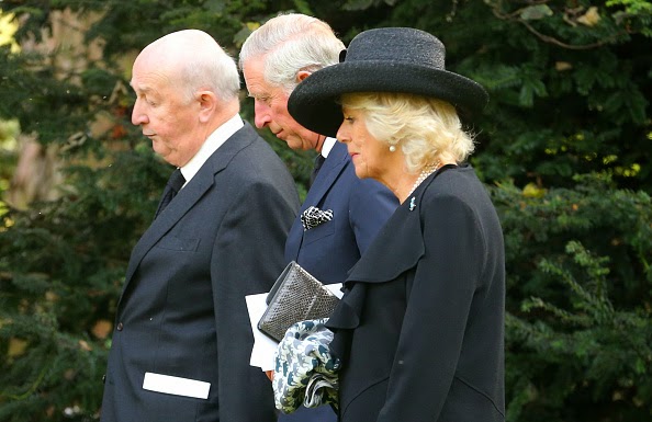  Prince Charles, Prince of Wales, and Camilla, Duchess of Cornwall make their way to the burial plot following the funeral of Deborah, Dowager Duchess of Devonshire at St Peter's Church, Edensor on 02.10.2014 in Chatsworth, England.