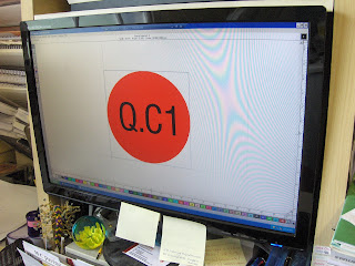Photograph of monitor with signlab open designing stickers.