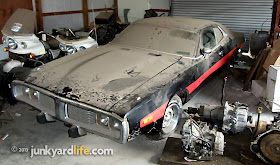 Black 1973 Dodge Charger 440 Rallye parked in storage building at Stinnett's Auto Parts in Alabama on junkyardlife.com