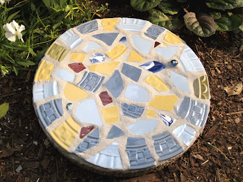 Crafting a mosaic garden stone...
