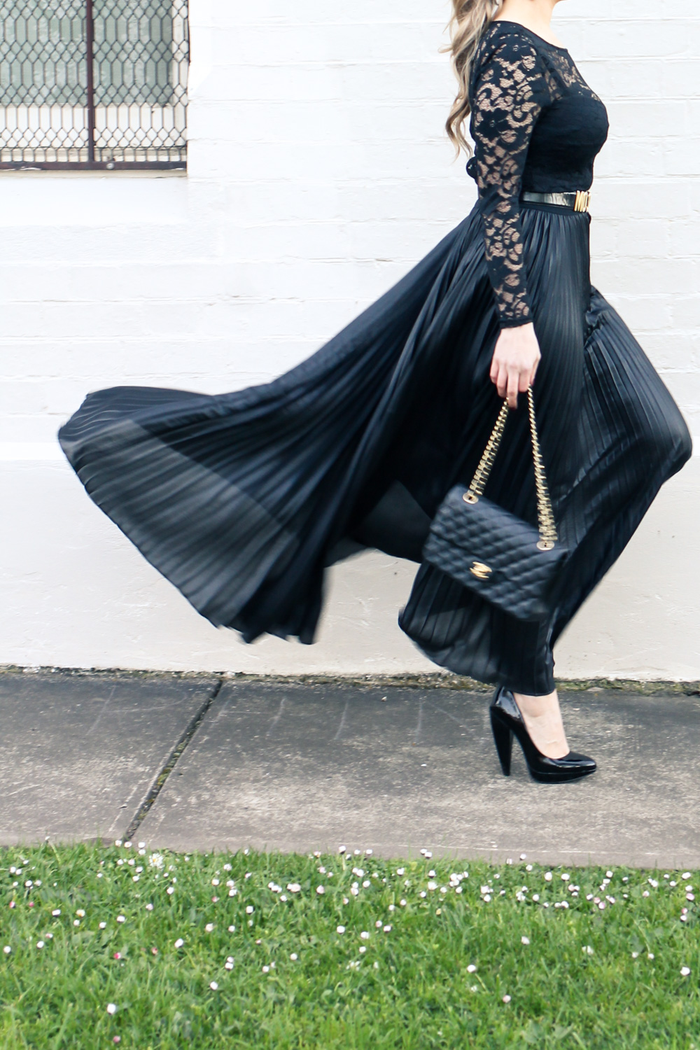 Goldfields Girl styling all black pleated maxi skirt, Moschino belt and Chanel bag