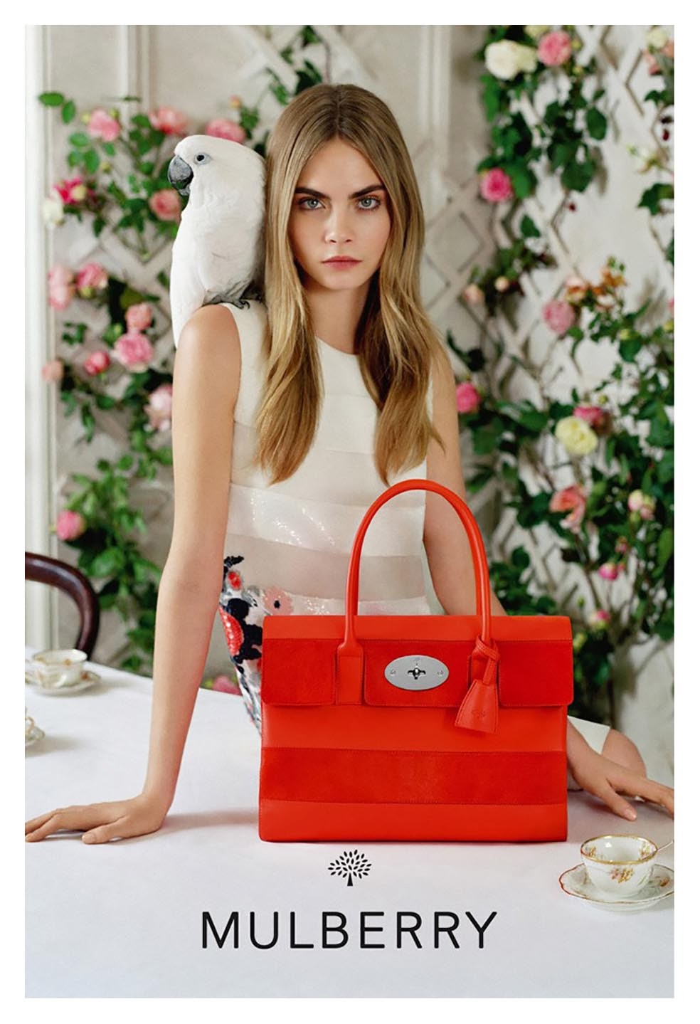 Kiwi's Angels: Cara Delevingne with cockatoo for Mulberry's SS14 campaign