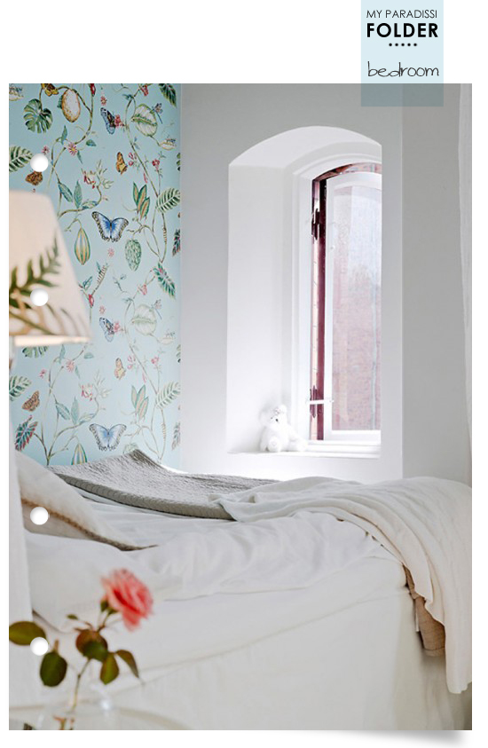Bedroom with wallpaper and arched window