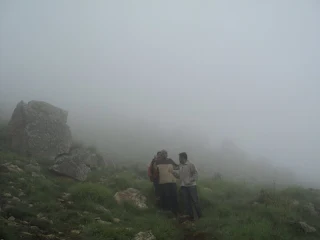 Hikers help each other out at the Skandagiri night trek amidst the fog