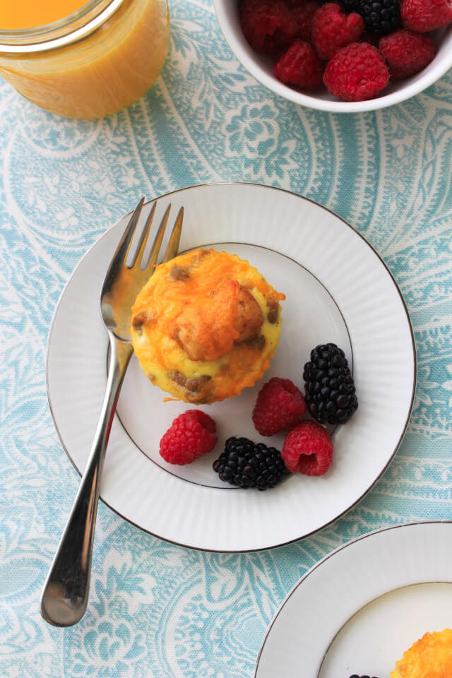 Cheesy Sausage and Tater Tot Breakfast Muffins combine maple turkey sausage, tater tots, eggs, and cheddar cheese in an easy to make muffin cup that can be made ahead and reheated on busy mornings! #ad #BackToButterball