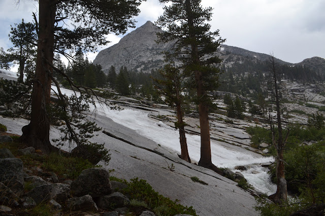 long and nearly perfect sheet of water coming down a long, nearly unbroken slanted rock face