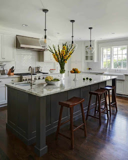 Beautiful Light Filled Kitchen With White Countertops