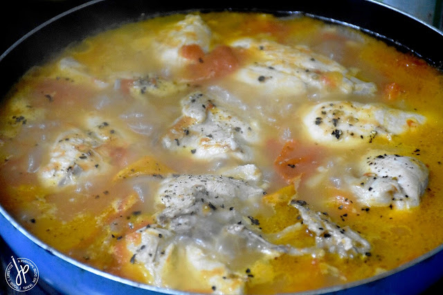 Chicken Afritada: Simmering chicken in tomatoes
