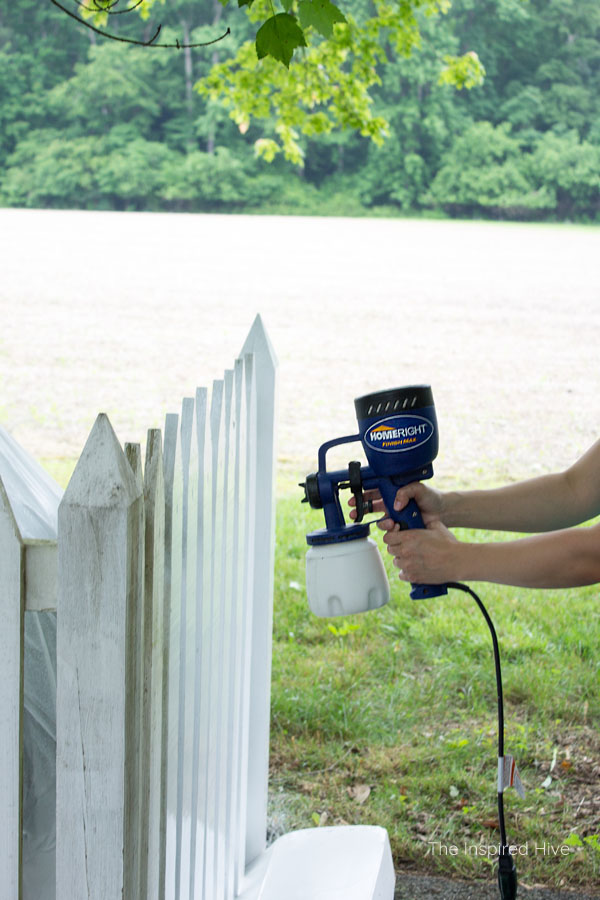 Great idea to hide a propane gas tank in the yard with a cute picket fence! Plus how to maintain the fence to keep it nice and bright.