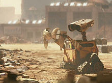WALL-E wandering a barren landscape animatedfilmreviews.filminspector.com