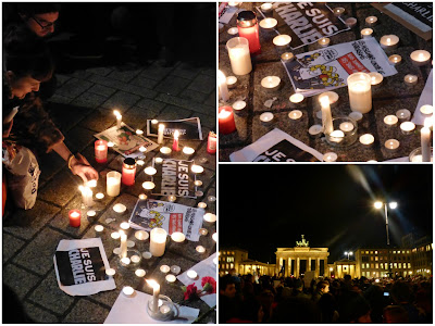 Kerzen, Karikaturen und "Je suis Charlie"-Blätter vor dem Brandenburger Tor