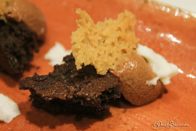 Delicious Gourmet Vegetarian Recipe Ginger Mousse with soft cocoa biscuit, rosemary snow and caramel 