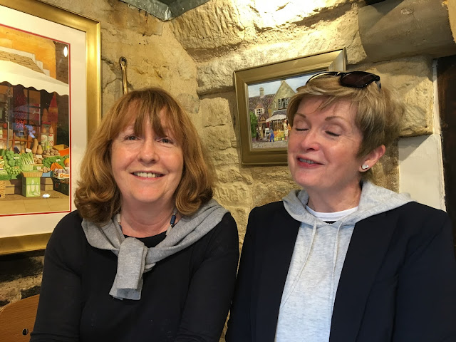 Wrapping up England: Rosie and me in Broadway two women in a cafe with stone walls
