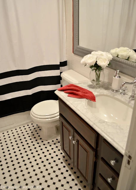 White and black shower curtain in the bathroom