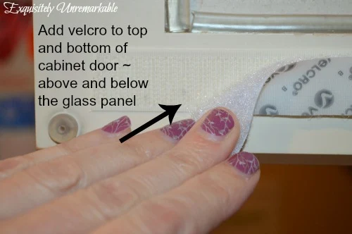 add velvro to top and bottom of cabinet door above and below the glass panel text over photo demonstrating