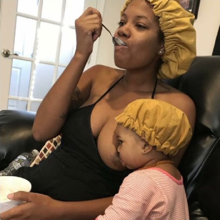 Woman eating while breastfeeding