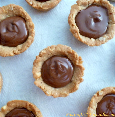 Crunchy Peanut Butter Nutella Cups, crunchy mini peanut butter flavored cups filled with creamy nutella | Recipe developed by www.BakingInATornado.com | #recipe #bake #peanutbutter