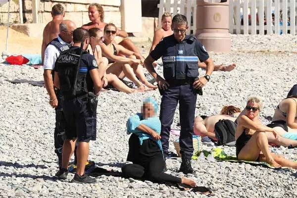 Burkini, Body-concealing, Women, Swimsuit, Fits, Islamic dress code, Stirred, Controversy in France, Family, Allegation, World