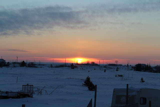 Sunset across frozen fields