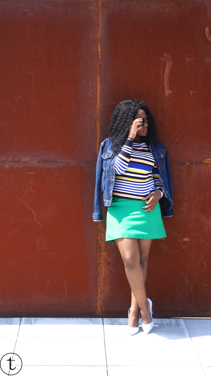 outfit post wearing jeans jacket and green skirt from zara east london