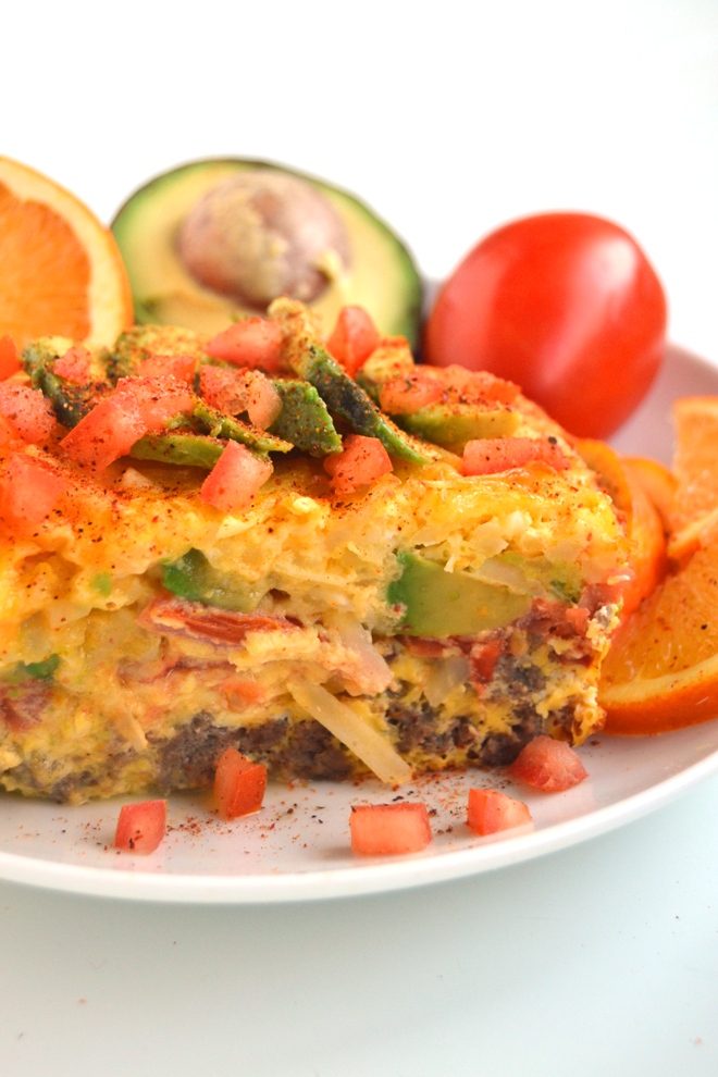 California Breakfast Casserole features layers of turkey sausage, tomato, avocado and hash browns for a hearty breakfast that can be made the night before and baked in the morning! www.nutritionistreviews.com