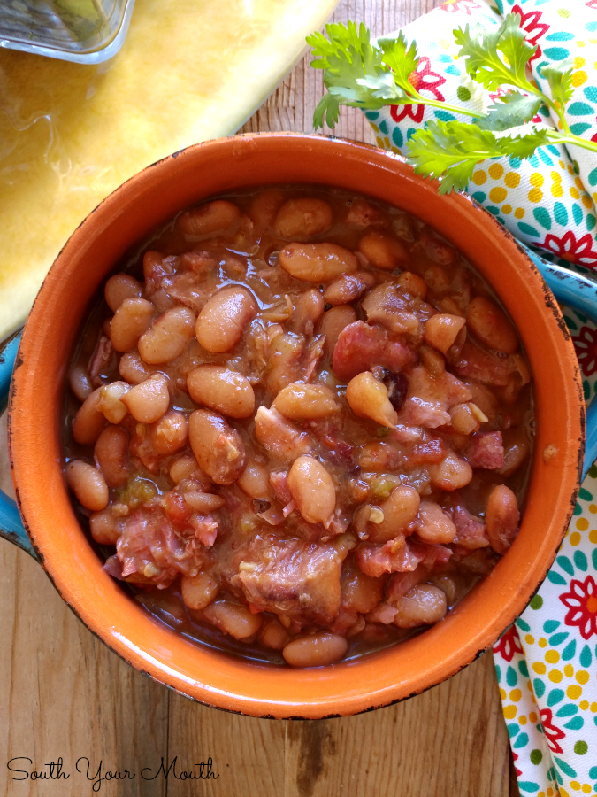 Mexican Borracho Beans cooked low and slow with pinto beans, pork, spices and beer. THE PERFECT side dish to your next Mexican feast!