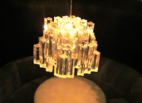 Close up of a modern dolls' house miniature 1970s-style chandelier.