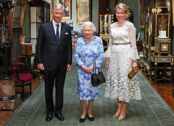 King Philippe and Queen Mathilde met with Queen Elizabeth II at Windsor Castle.Belgian Remembrance Parade. Queen wore Natan dress