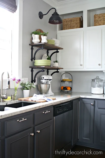 Dark gray base cabinets and white uppers