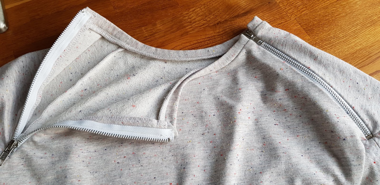 Queen of Darts: Papercut Undercover sweatshirt - nursing hack