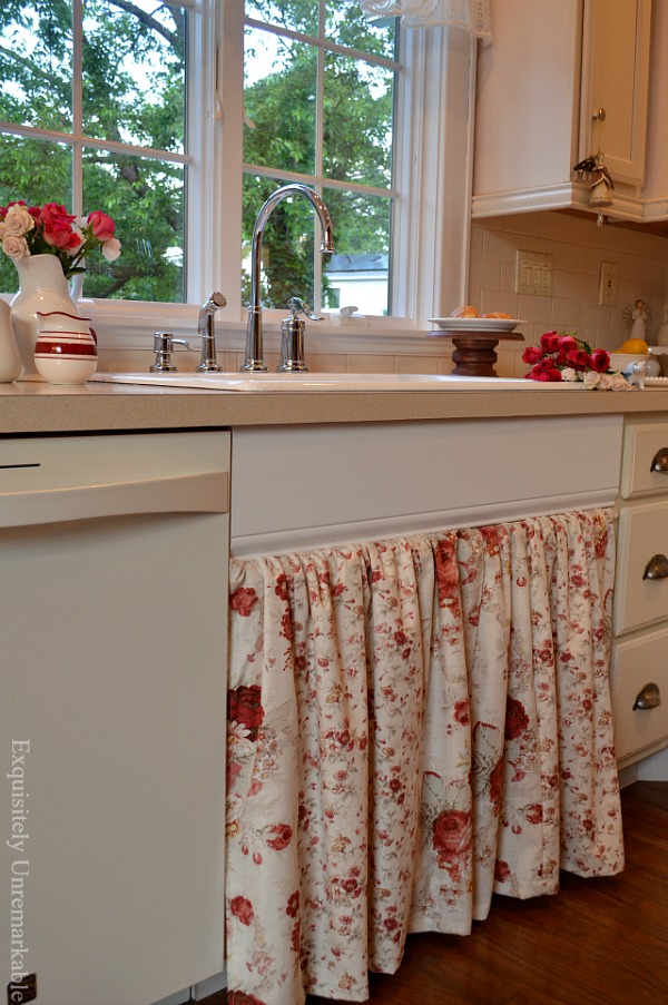 Floral kitchen sink skirt DIY that's easy to open in cream kitche