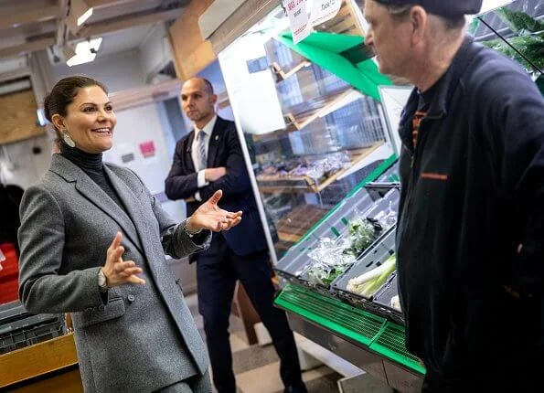 Crown Princess Victoria wore Erdem X H and M wool suit, Kreuger Jewellery summer feather earrings, Valentino shoulder bag. City Mission