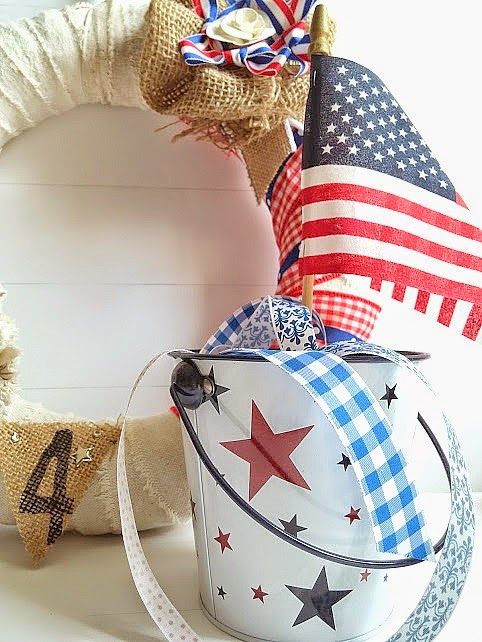 Wow, this wreath got a mini makeover for July 4th and it's stunning! I saved storage space in my home by repurposing what I already had! To see how I made this wreath, visit diy beautify.