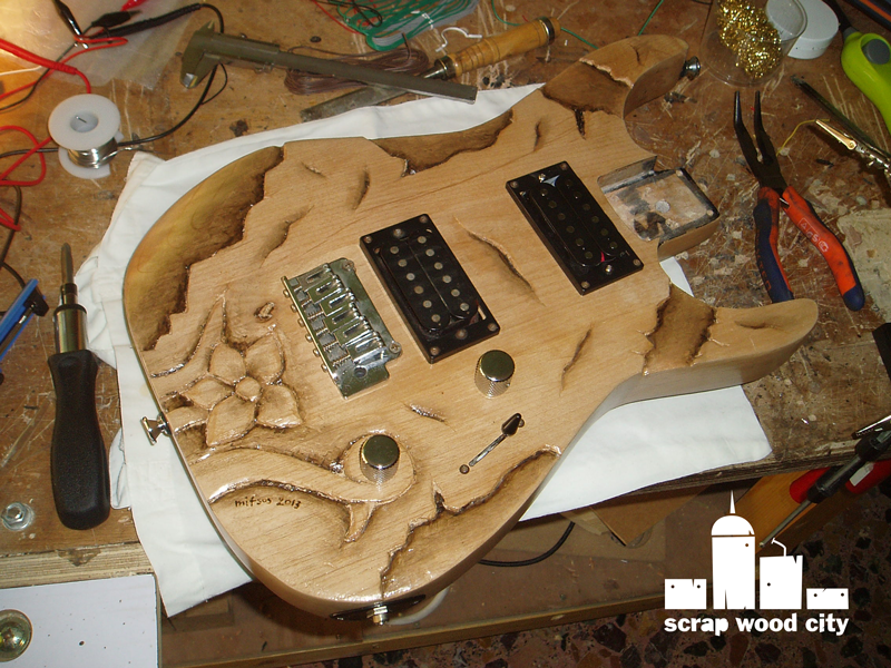 scrap wood city Carving an old Jackson electric guitar body