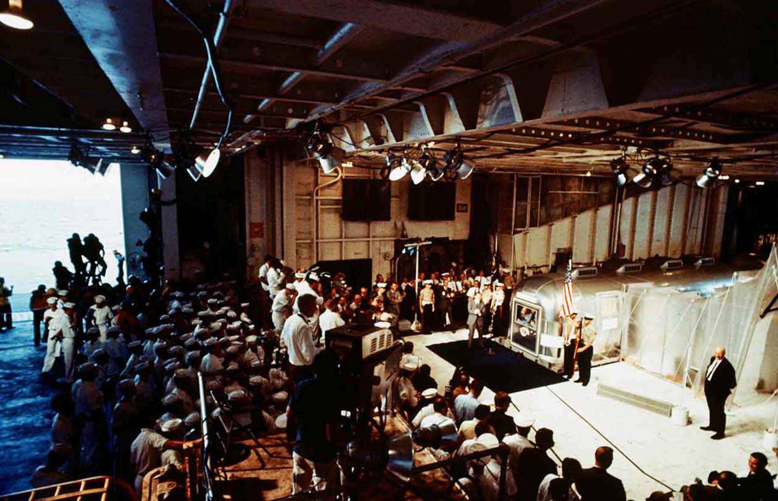 Overall of scene surrounding quarantined astronauts after splashdown of Apollo XI mission.