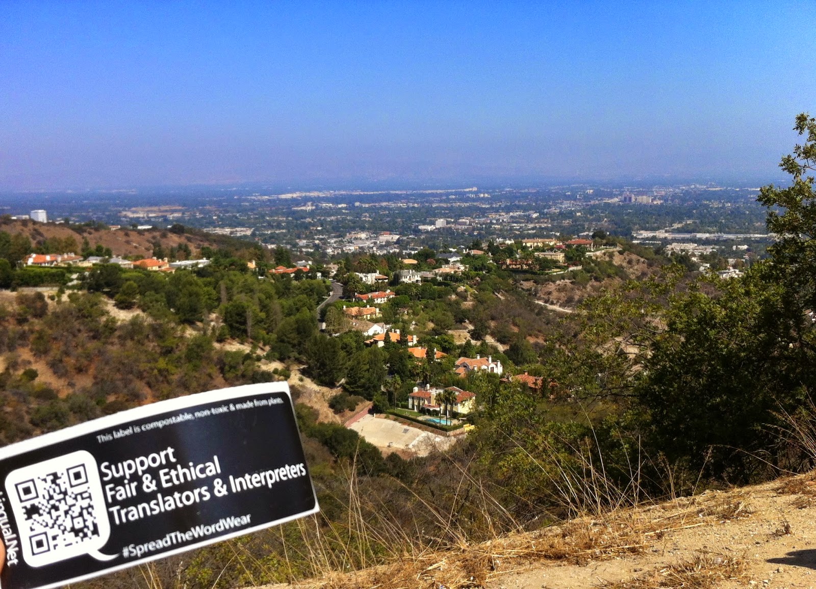 Fair and ethical translators and interpreters sticker tagging campaign for elingual.net and spreadthewordwear.com North Hollywood supports fair and ethical translators and interpreters