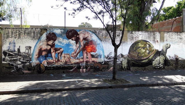 "Castles In The Sand" New Street Art Collaboration by Australian artist Fintan Magee and Martin Ron in Buenos Aires. 1