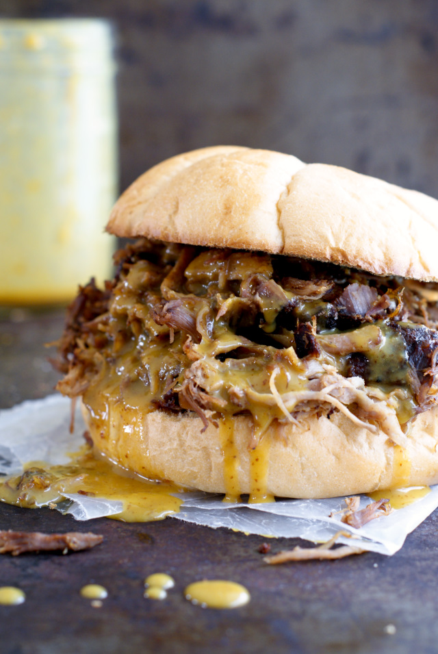Oven Roasted Pulled Pork with Honey Mustard BBQ Sauce is a spice-rubbed pork shoulder that is roasted low and slow in the oven, fork shredded, and then drizzled with a zesty and sweet mustard barbecue sauce.