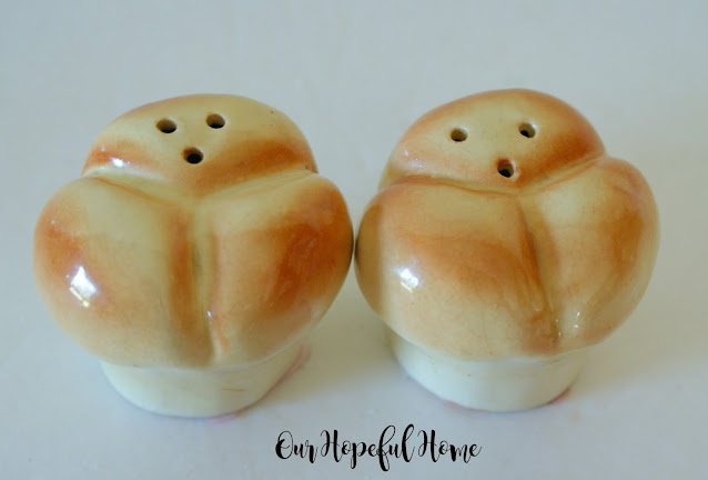 two porcelain bread roll salt and pepper shakers