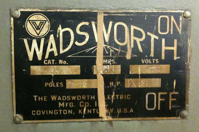 Wadsworth brass and black letters on a metal door