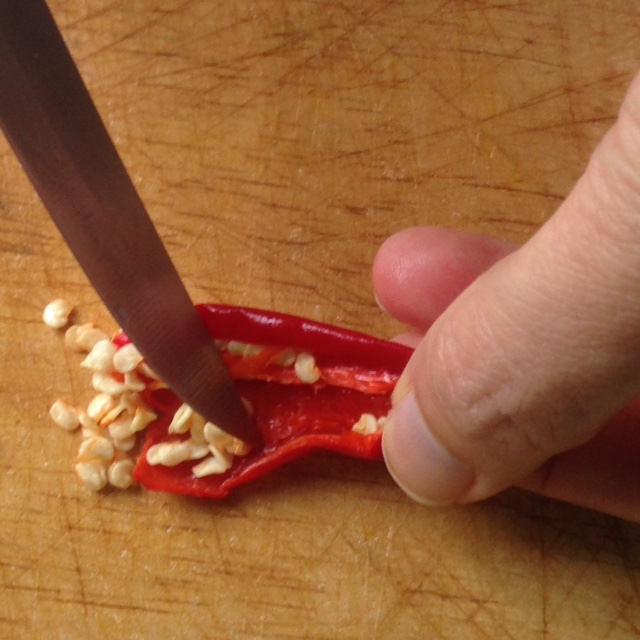 red Thai chili with seeds being removed