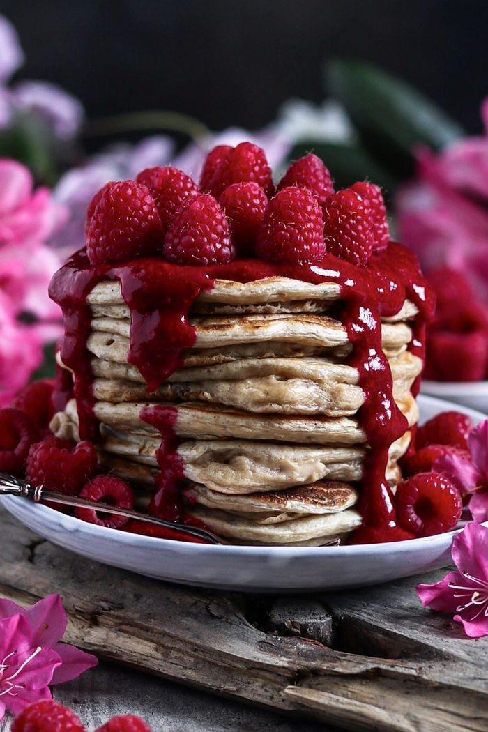 Vegan Oat Pancakes with Raspberry Coconut Sauce. Need more recipes? Find 21 Easy and Healthy Vegan Oat Recipes To Make Best Weight Loss Breakfast Ever! vegan breakfast oatmeal | raw oatmeal recipes | delicious oatmeal recipes |overnight oatmeal recipes | good oatmeal recipes #oats #oat #veganmeal #vegan 