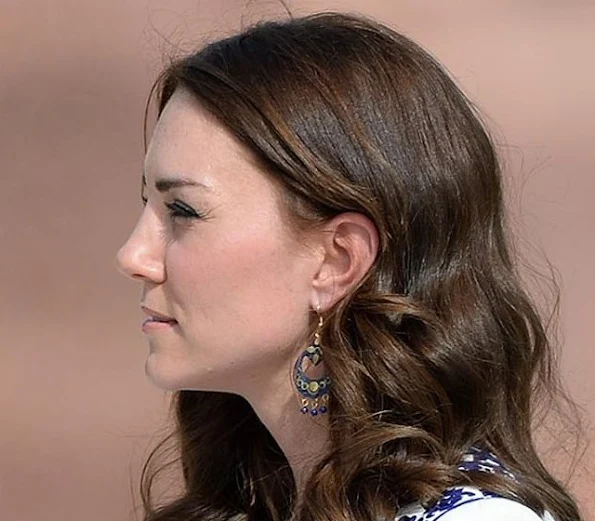 Kate wore the blue earrings she purchased during her hike to Tiger's Nest